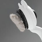 Brosse autonettoyante pour chat